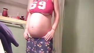Sexy pregnant housewife dances in the shower for hubby